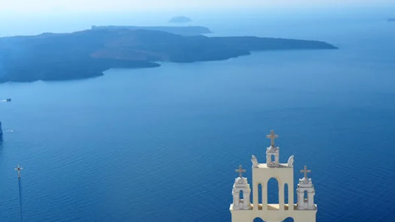 Santorini white buildings blue domes caldera sea view
