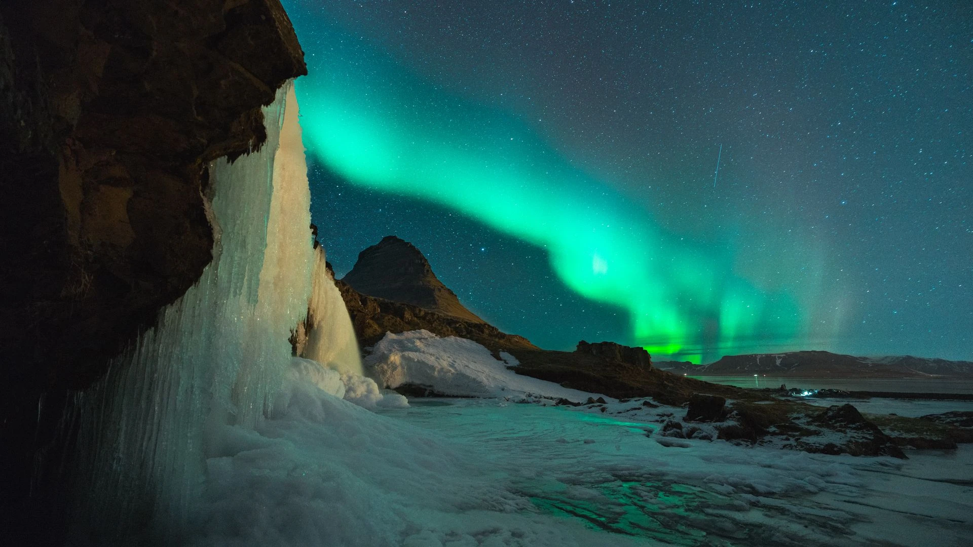 Iceland landscape with dramatic waterfall and volcanic terrain