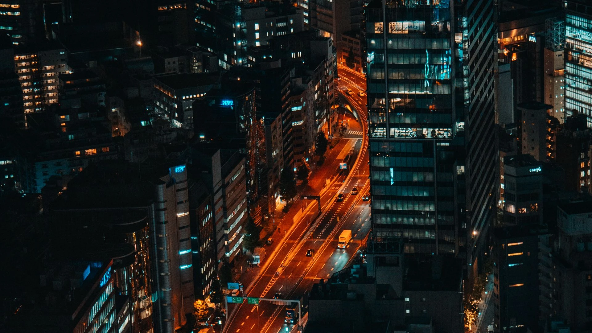 Tokyo city skyline at night with neon lights and skyscrapers