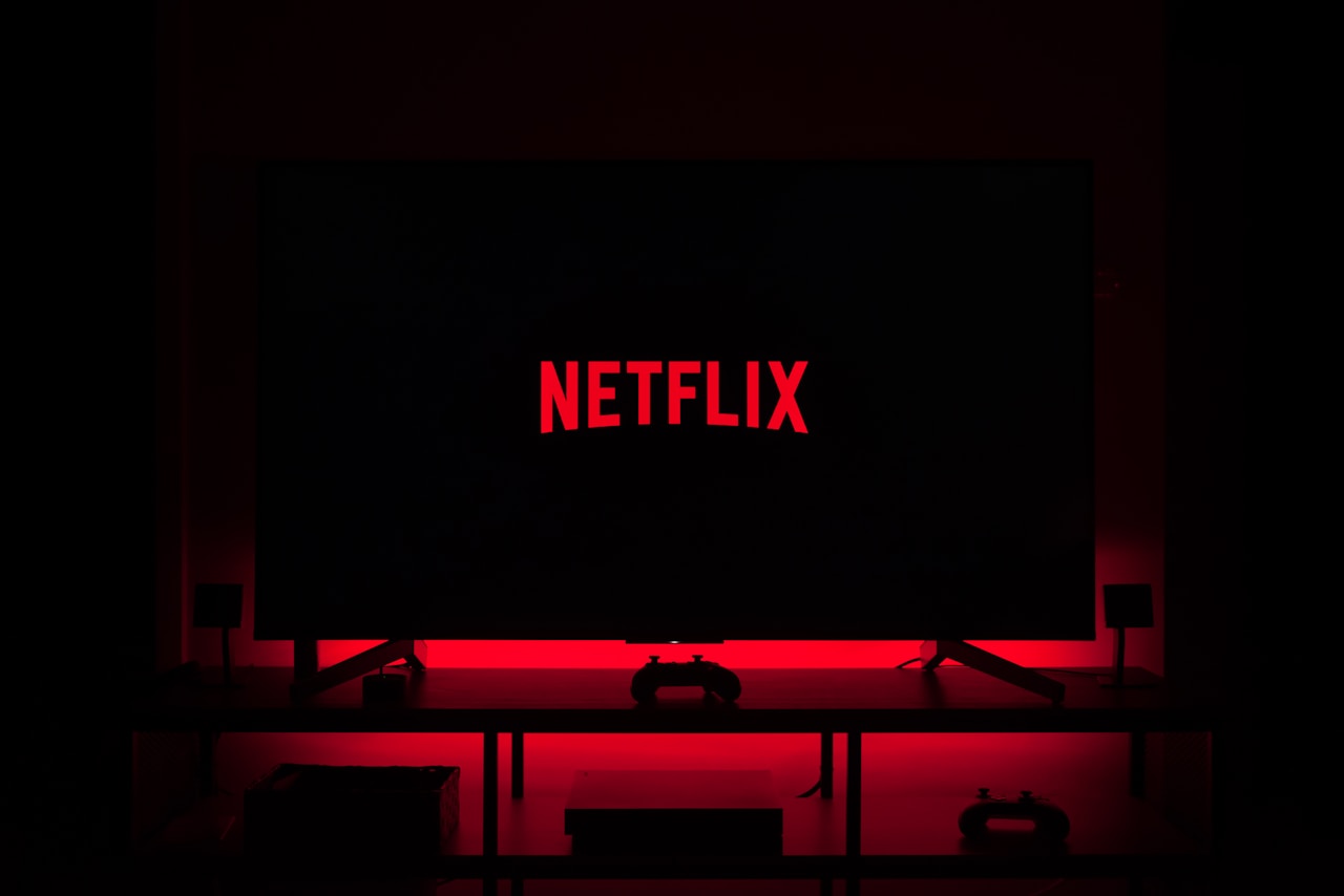 TV remote and popcorn on coffee table ready for Travelers Netflix series binge
