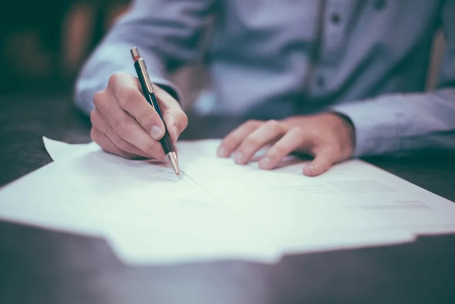 Travel nurse reviewing tax documents and stipend records with accountant for annual filing