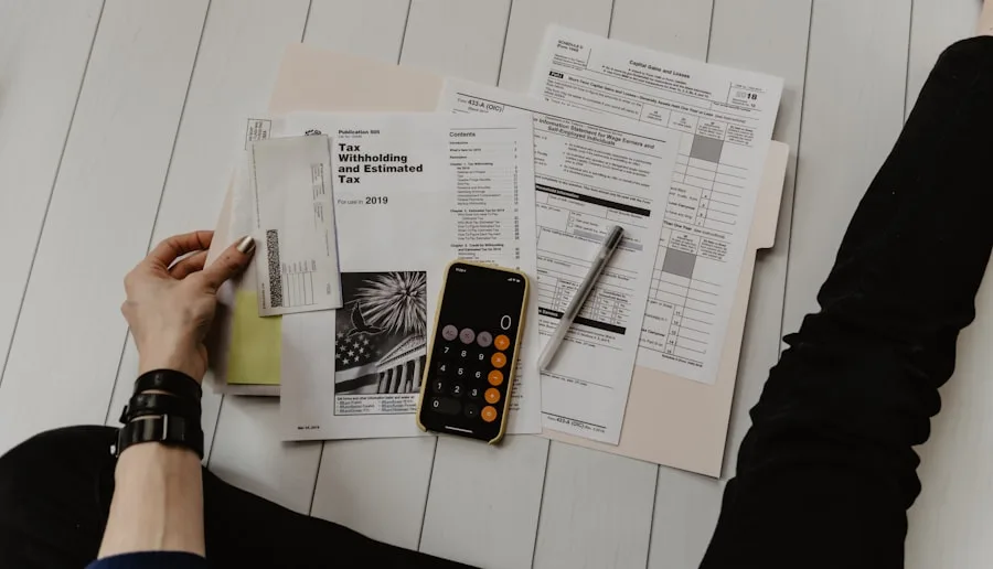 Travel nurse salary breakdown chart with calculator and pay stub documents on desk