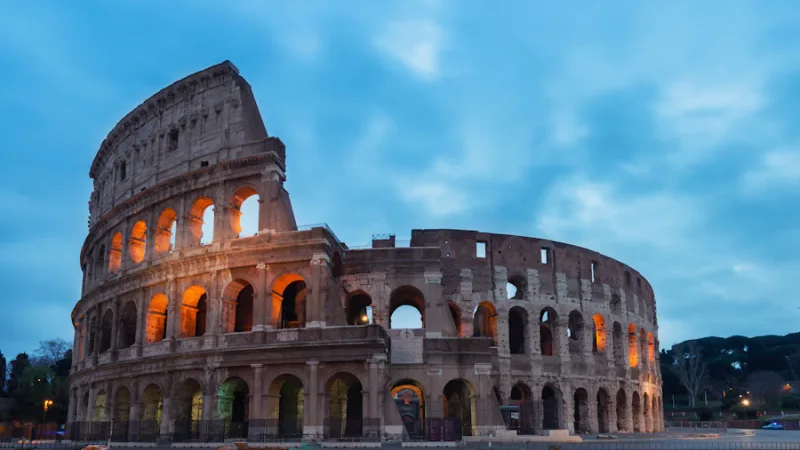 Rome Colosseum ancient amphitheatre illuminated at dusk